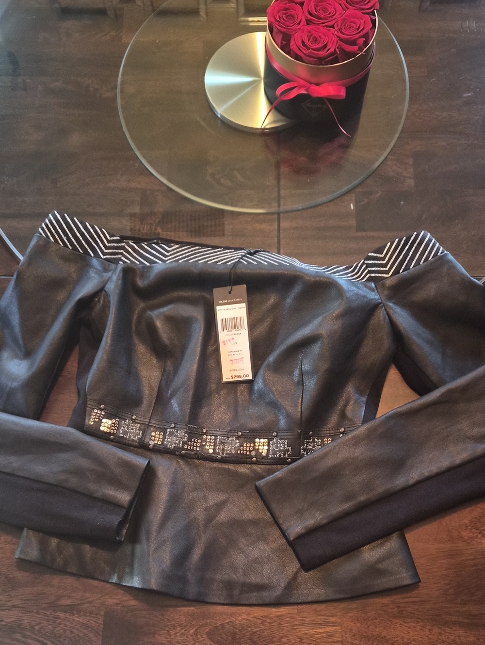 BCBGMaxAzria Black Off-Shoulder Faux Leather Jacket with Embellished Waist